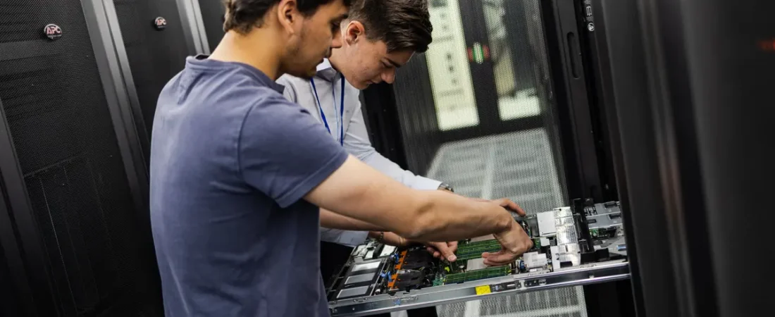 AI-ready data center operations technicians maintaining a rack-mounted server
