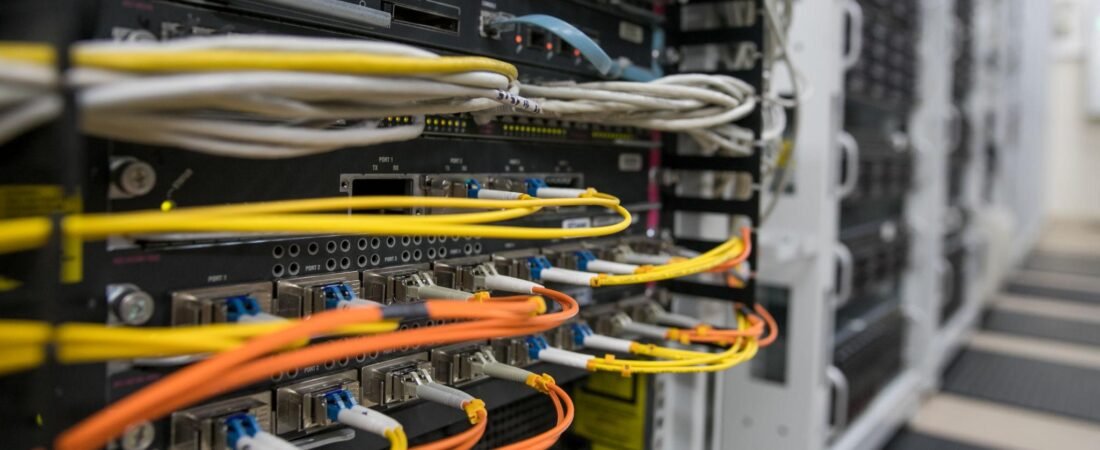 Fiber-optic connections supporting optical circuit switching in an AI data center network